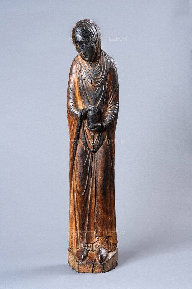 Woman carrying holy oil