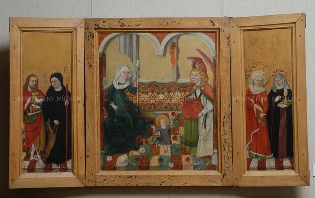 Triptych, an image of Infantia Christi in the centre, depictions of saints on the wings
